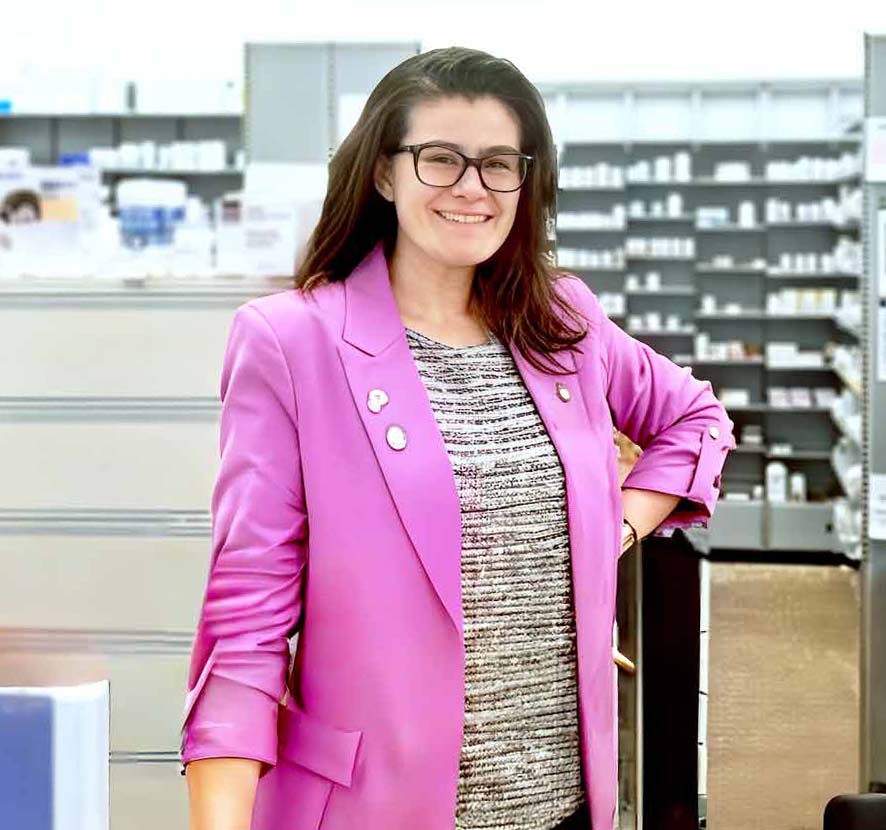 A Neighbourly pharmacist working in a store.
